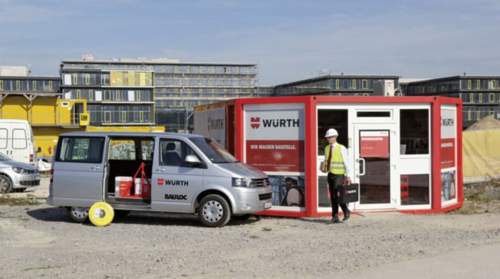 Baustelle Baustelle, Container Würth, Transporter Würth, davor Bauarbeiter